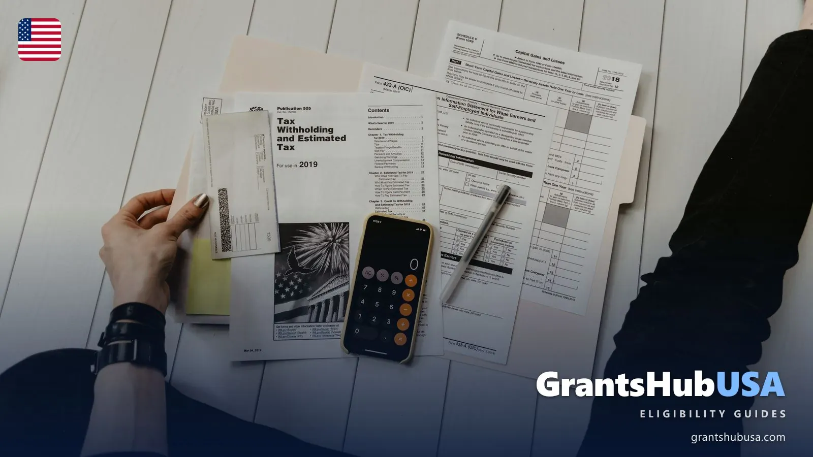 Calculator, laptop, and bills on a desk for checking 2026 LIHEAP income limit eligibility. GrantsHubUSA state-by-state eligibility guide.