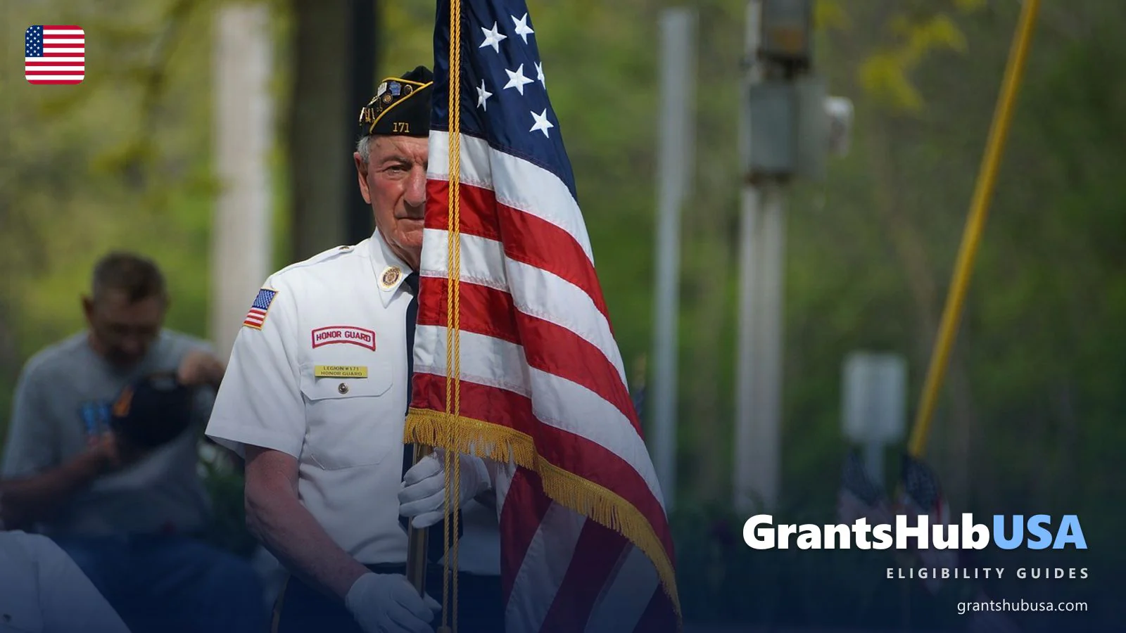 Senior US veteran in honor guard uniform holding the American flag — 2026 VA disability compensation rates editorial guide