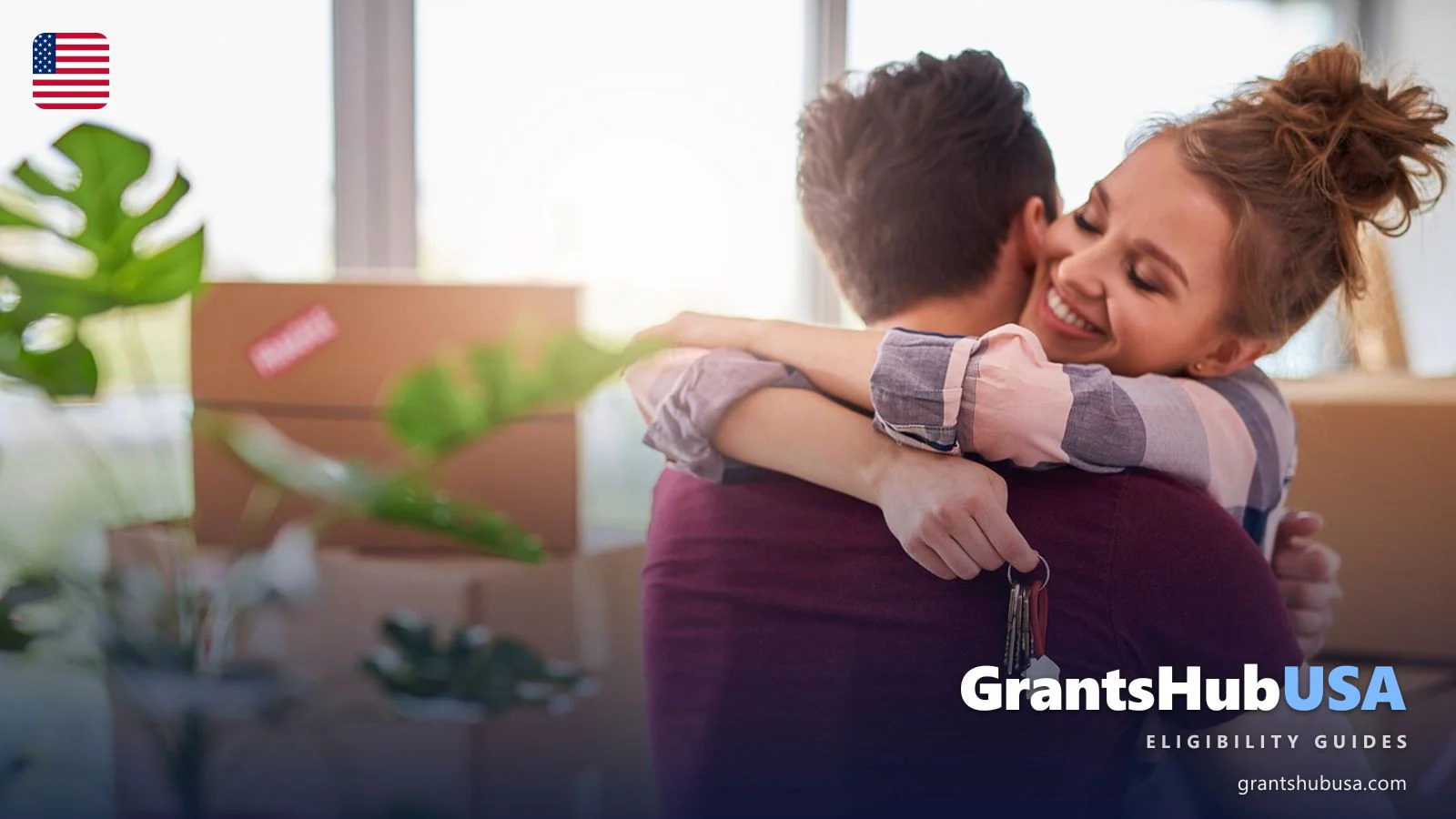 Couple hugging in a new apartment with house keys and moving boxes, receiving Section 8 voucher approval